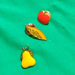 fruit hat pins. You get a Apple 🍎 🍐 pear and peas in a pod.